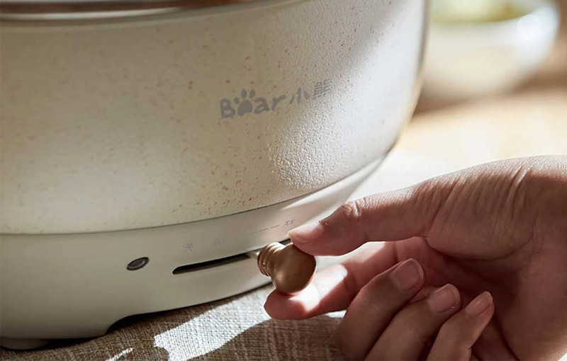 Điều chỉnh núm vặn hoặc thanh trượt của nồi lẩu điện Bear