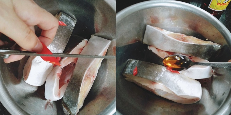 Ướp cá chim với gia vị trước khi nấu canh chua