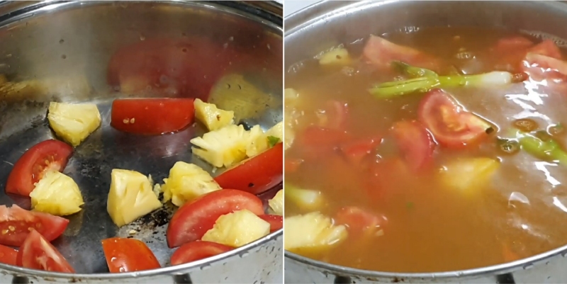 Nước lẩu trong nồi với cà chua và thơm