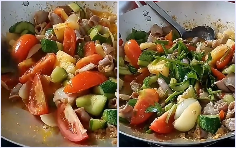 Lòng heo xào cà chua và ớt trong chảo.