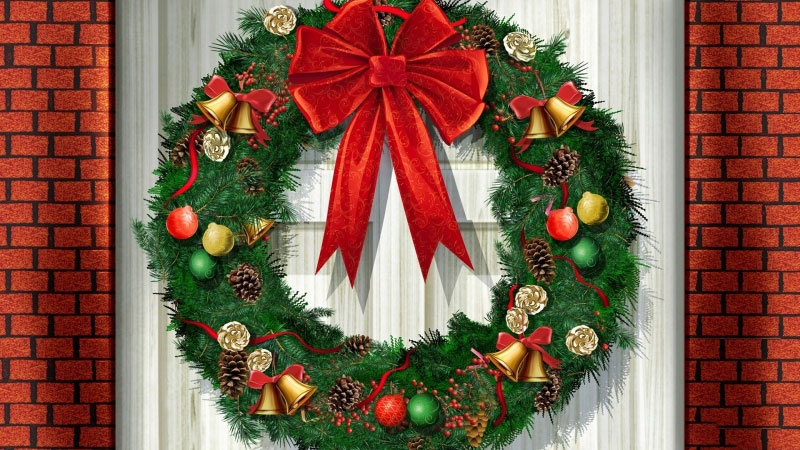 Vòng nguyệt quế Giáng Sinh treo cửa với nơ đỏ
