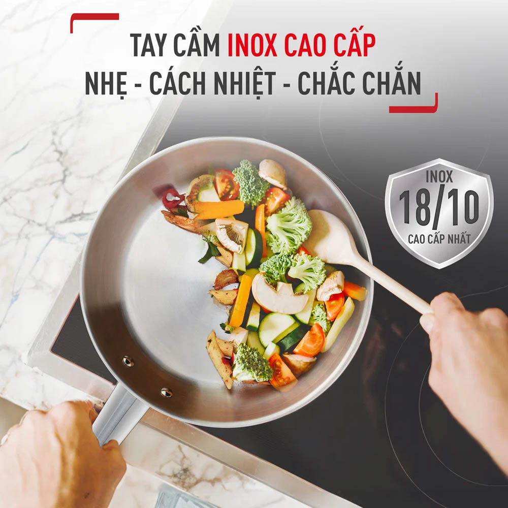 Cán chảo bằng inox nguyên khối, gắn chắc chắn vào thân bằng đinh tán