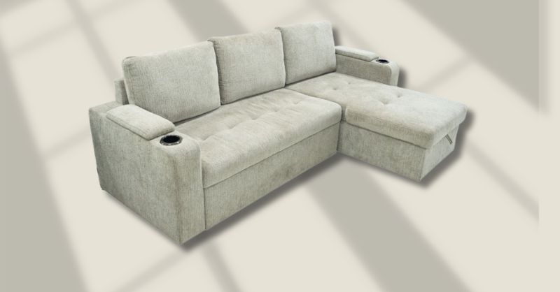 Sofa góc chữ L (góc trái) 8604 xám, thiết kế hiện đại với đệm ngồi dày, tay vịn tích hợp hộc để ly, phần ghế dài bên phải, phù hợp phòng khách